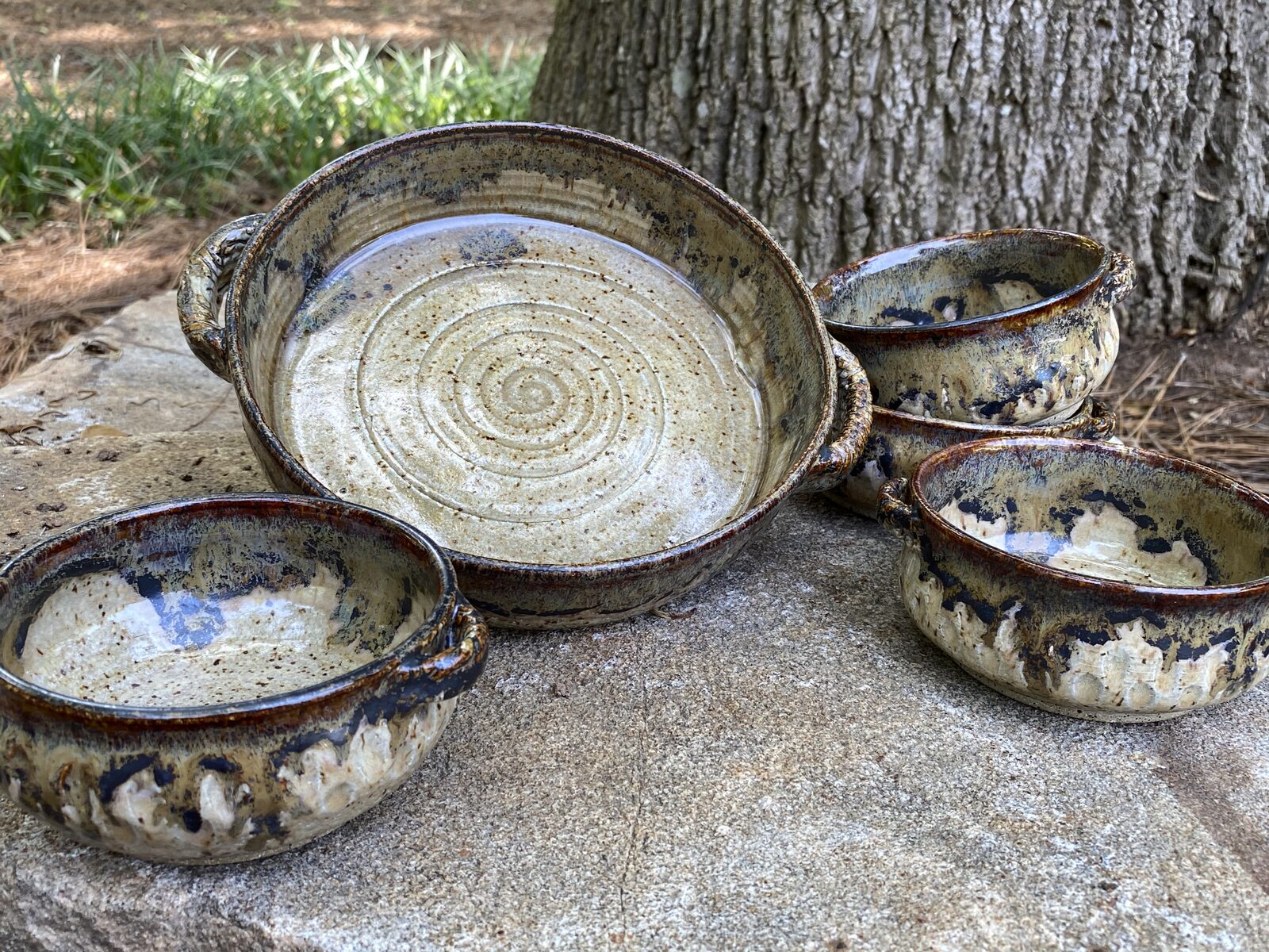 Serving set with large handled platter and matching small bowls in speckled brown and cream glaze